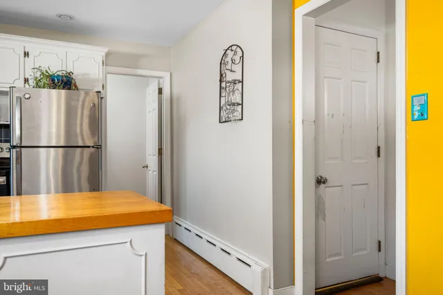 a room with a refrigerator and couch