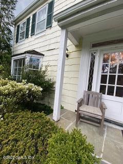 23 Copper Beech Road Greenwich, CT 06830 - Photo 10 of 15 a front view of a house with a garden