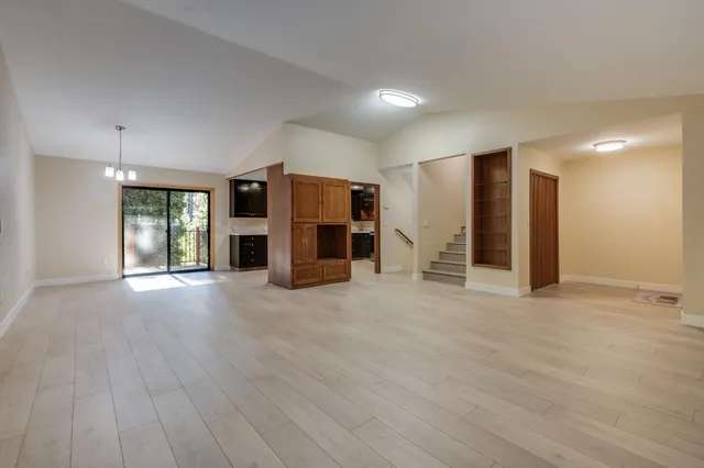 a view of a livingroom with furniture and a flat screen tv