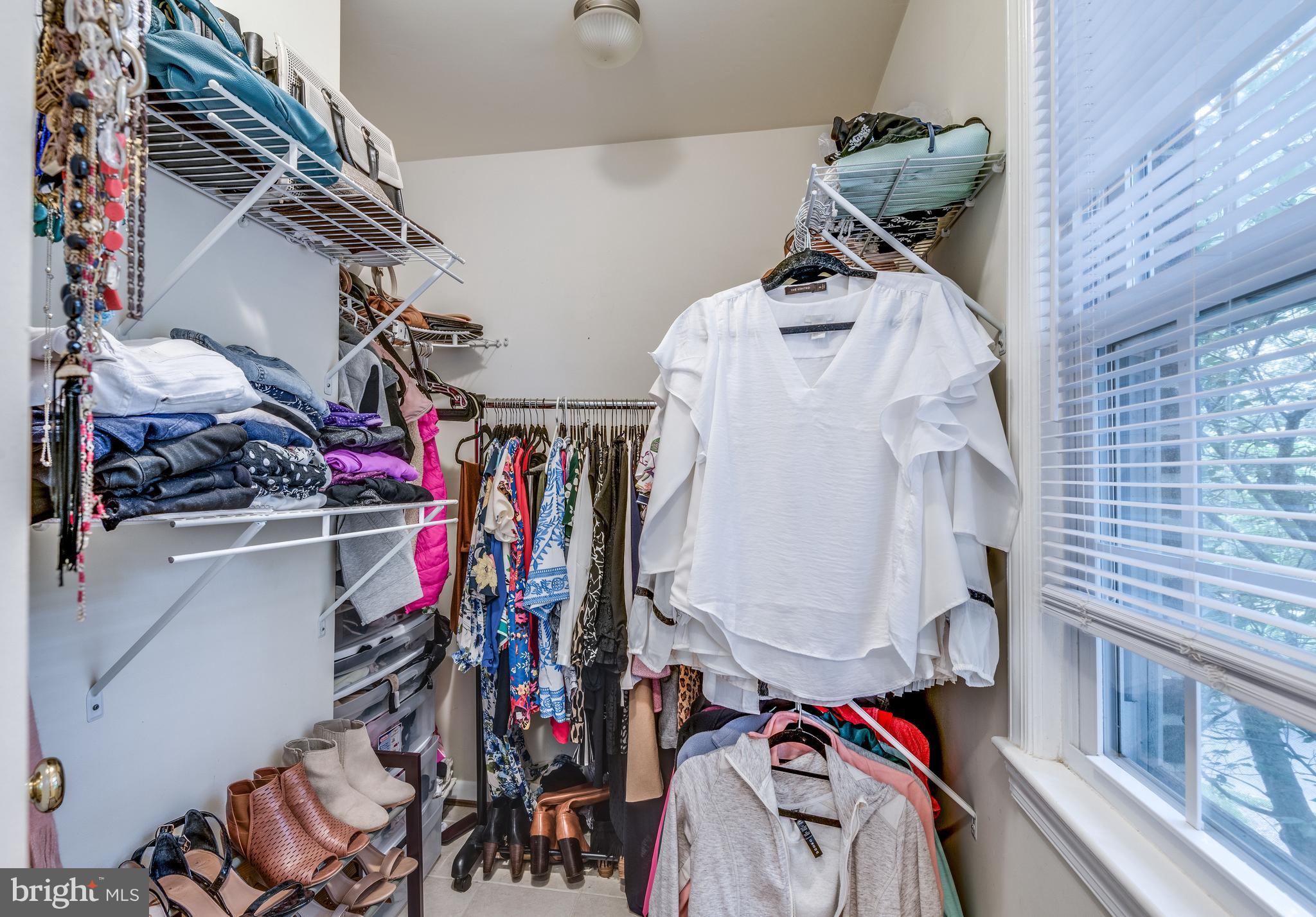 1804 Golf View Court Reston, VA 20190 - Photo 12 of 30 a view of walk in closet with clothes and shoes