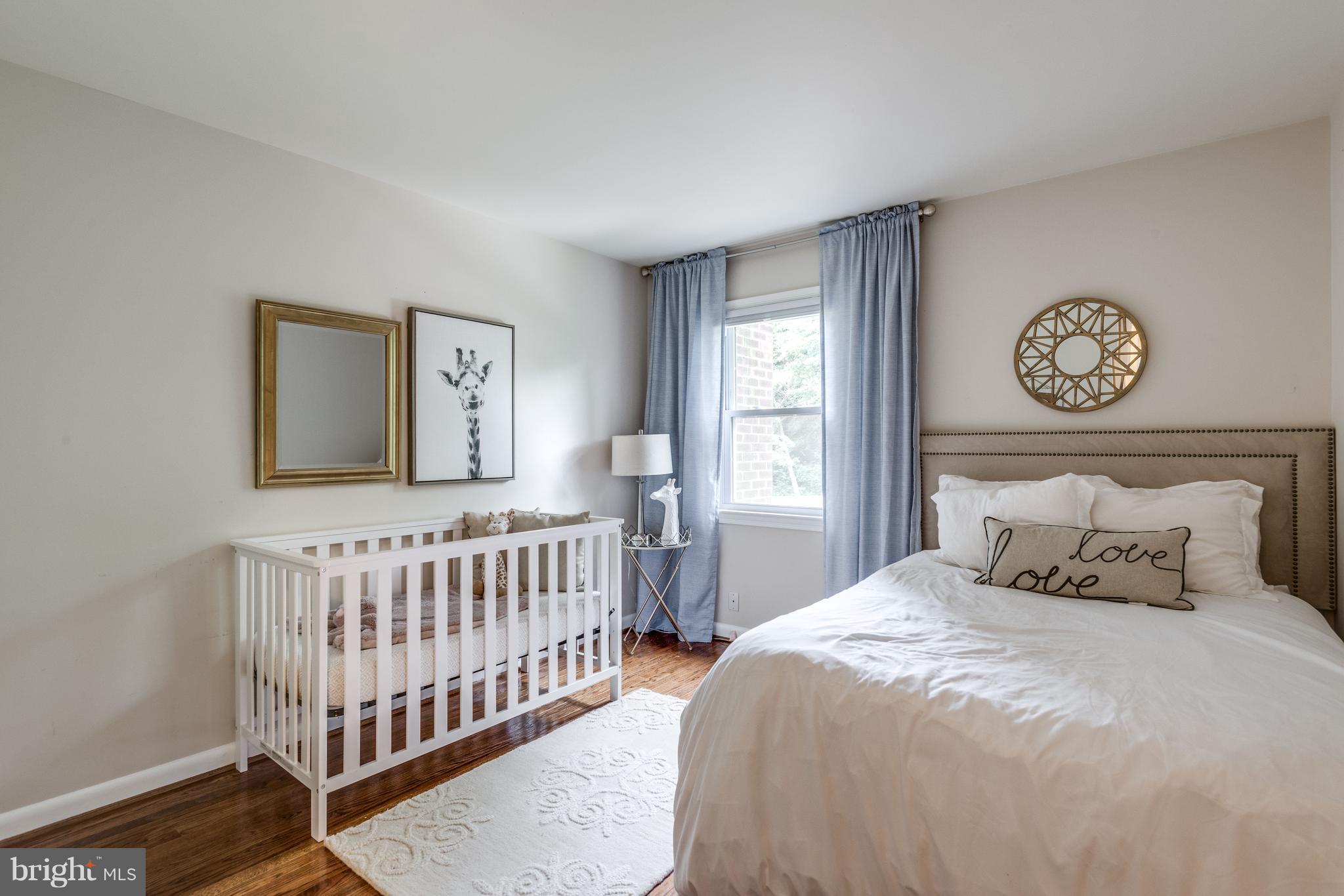 1804 Golf View Court Reston, VA 20190 - Photo 14 of 30 a bedroom with a bed and a window