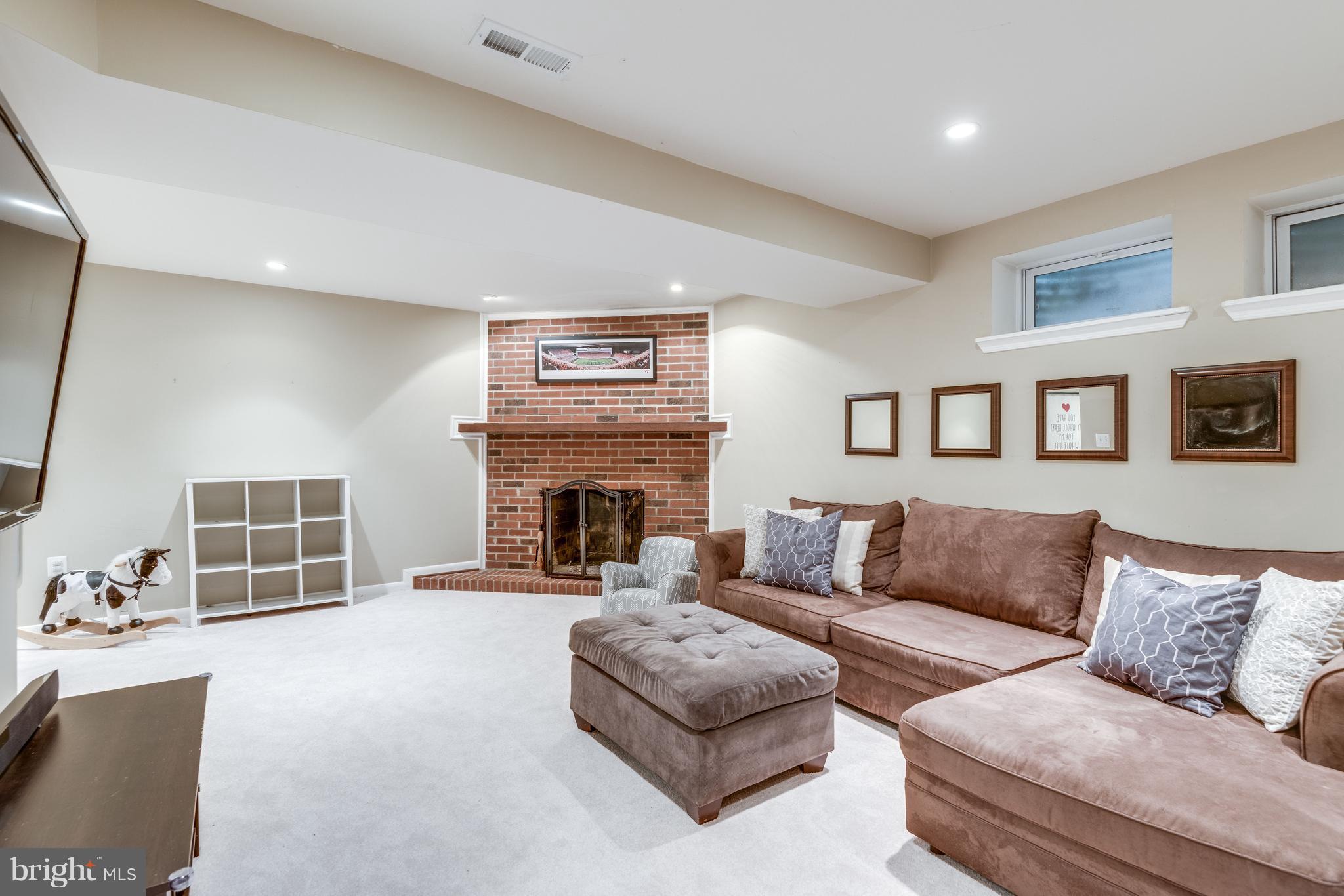 1804 Golf View Court Reston, VA 20190 - Photo 17 of 30 a living room with furniture and a fireplace