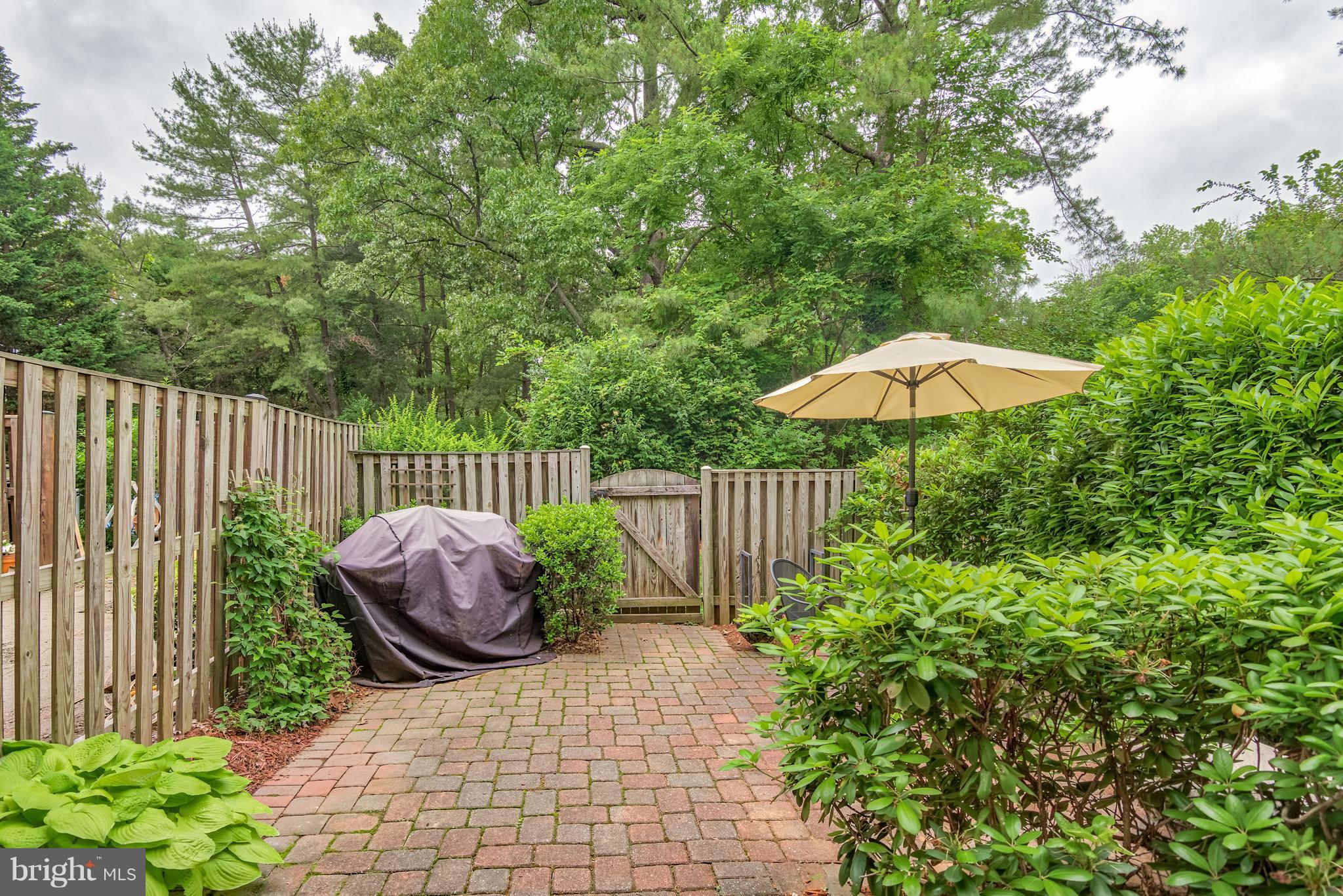 1804 Golf View Court Reston, VA 20190 - Photo 20 of 30 a view of a backyard with a swing and plants
