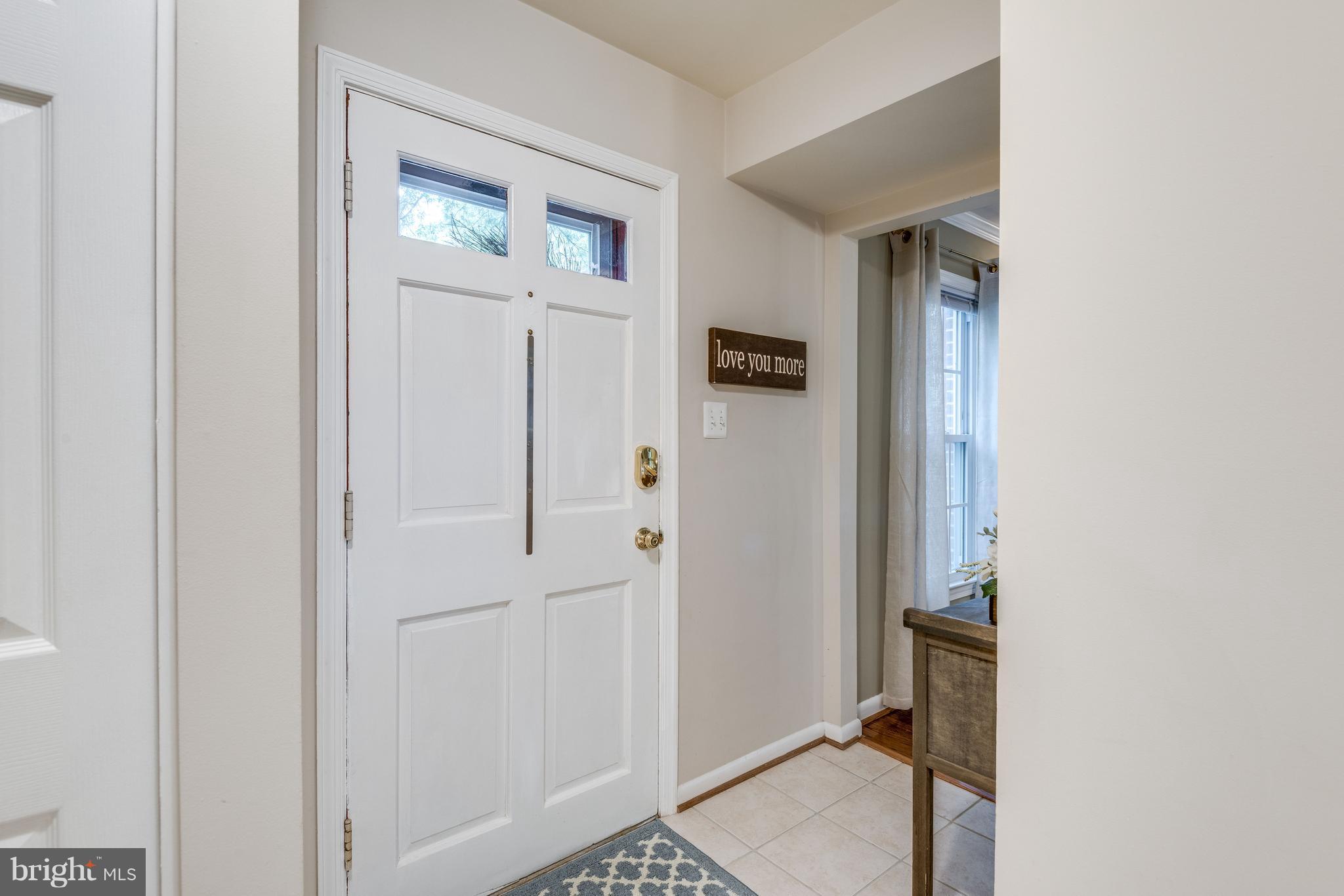 1804 Golf View Court Reston, VA 20190 - Photo 23 of 30 a view of a hallway with a livingroom and a bathroom