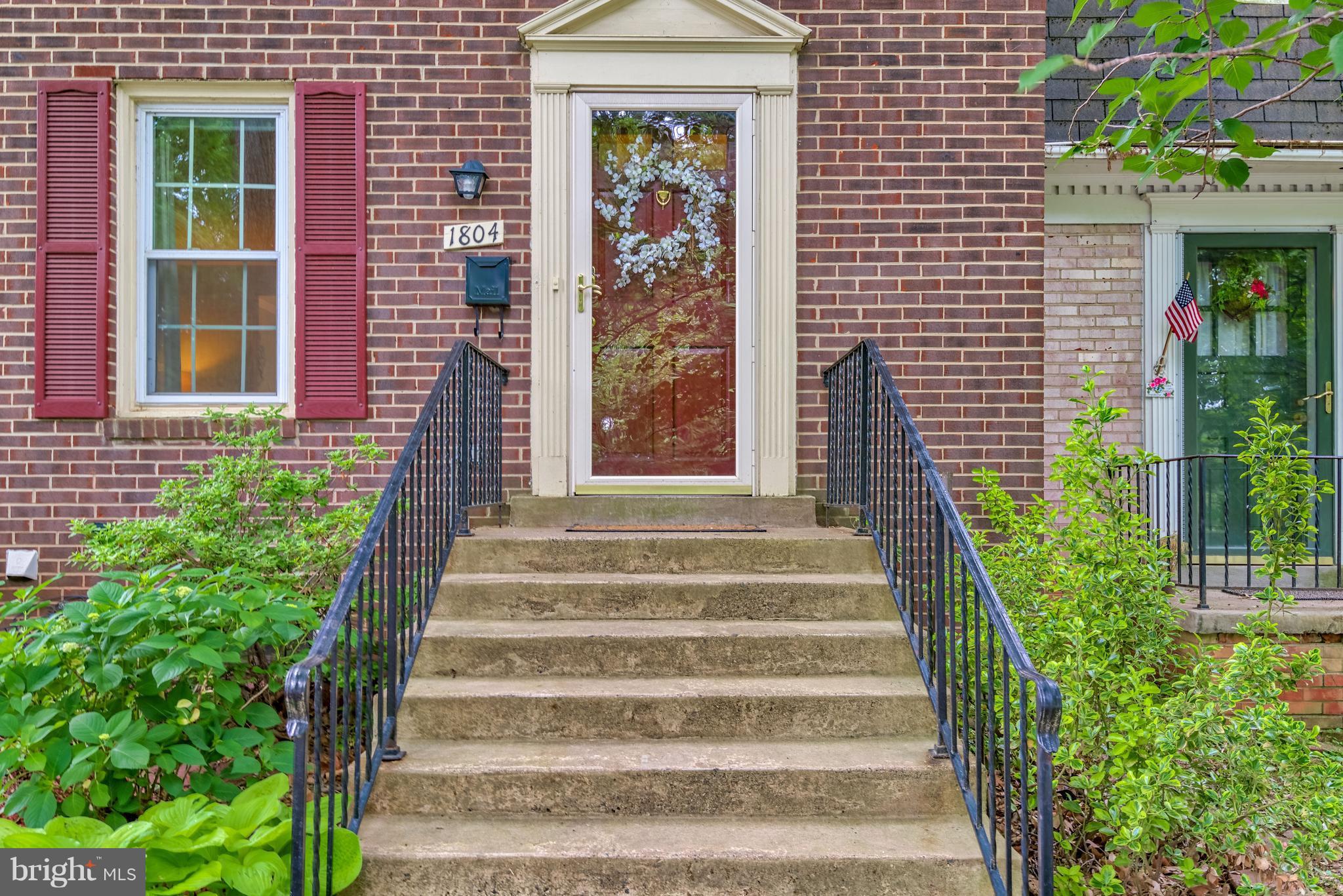 1804 Golf View Court Reston, VA 20190 - Photo 26 of 30 a front view of a house with a garden