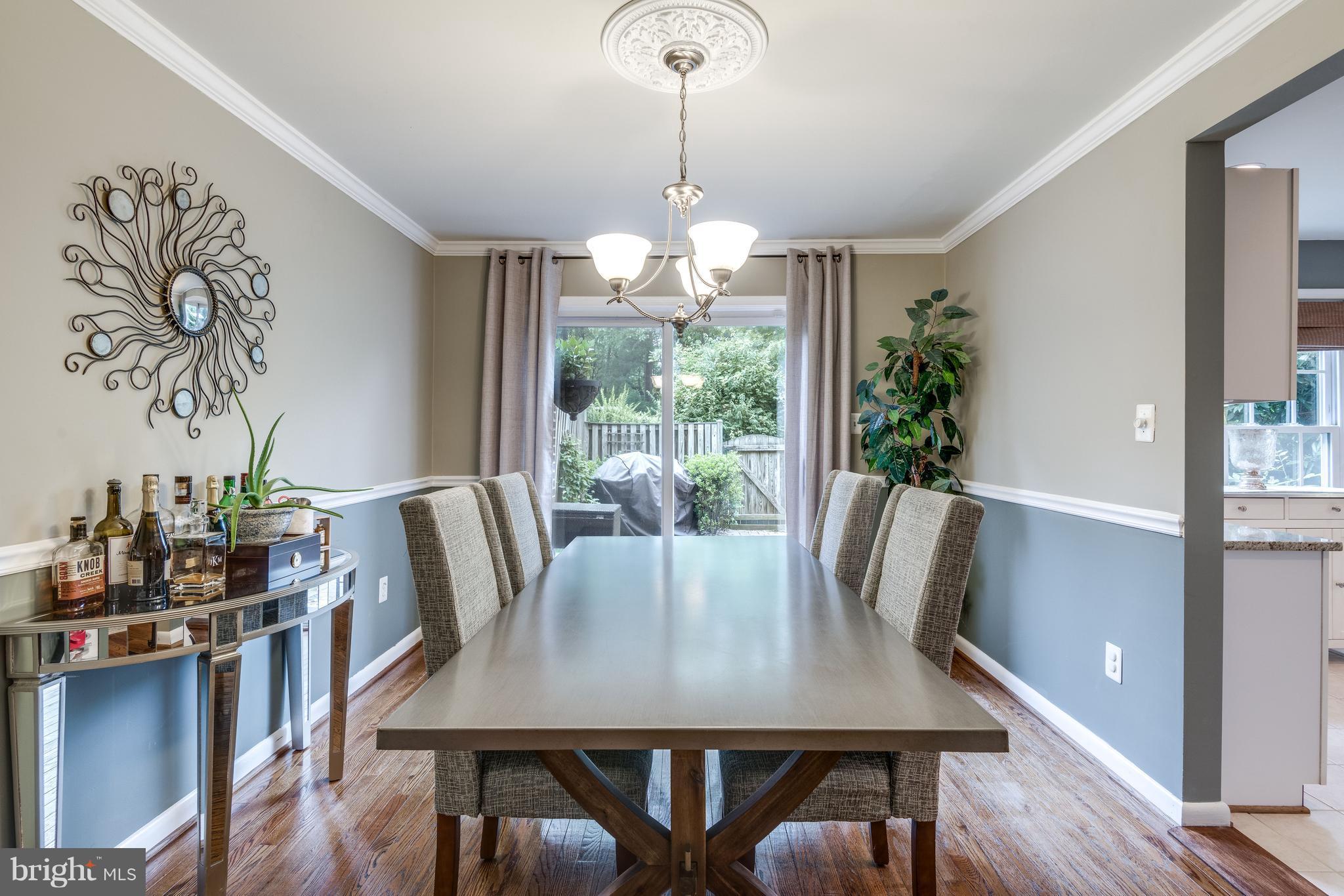 1804 Golf View Court Reston, VA 20190 - Photo 4 of 30 a view of a dining room with furniture window and wooden floor