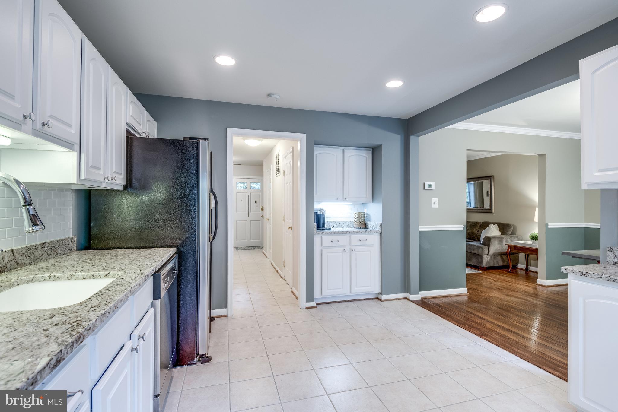 1804 Golf View Court Reston, VA 20190 - Photo 8 of 30 a kitchen with a sink refrigerator and cabinets