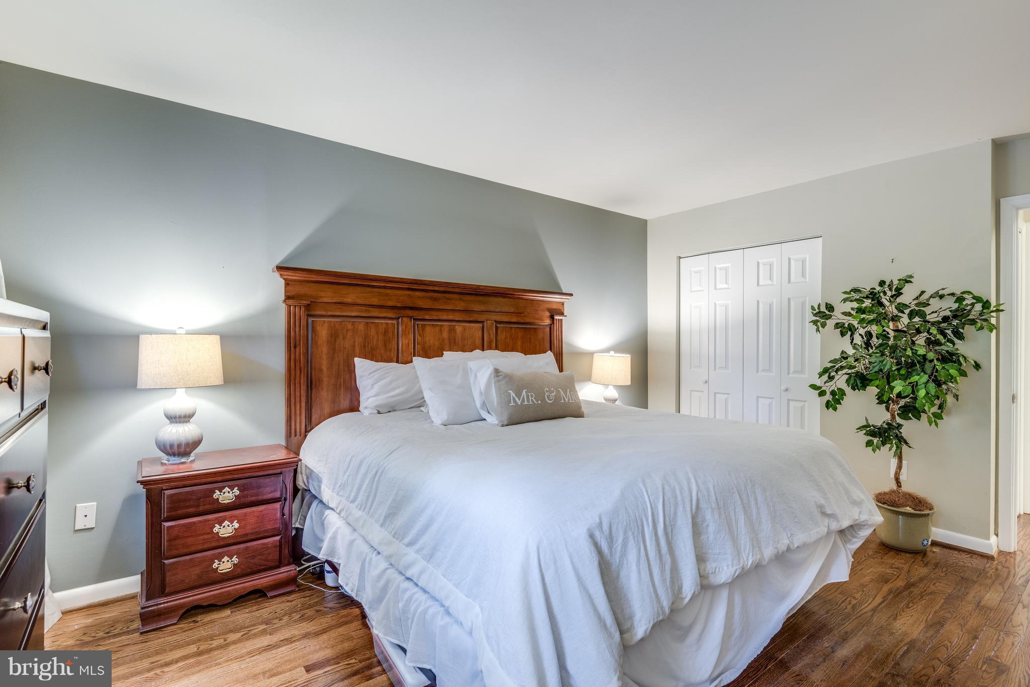 1804 Golf View Court Reston, VA 20190 - Photo 10 of 30 a bedroom with a bed and a potted plant