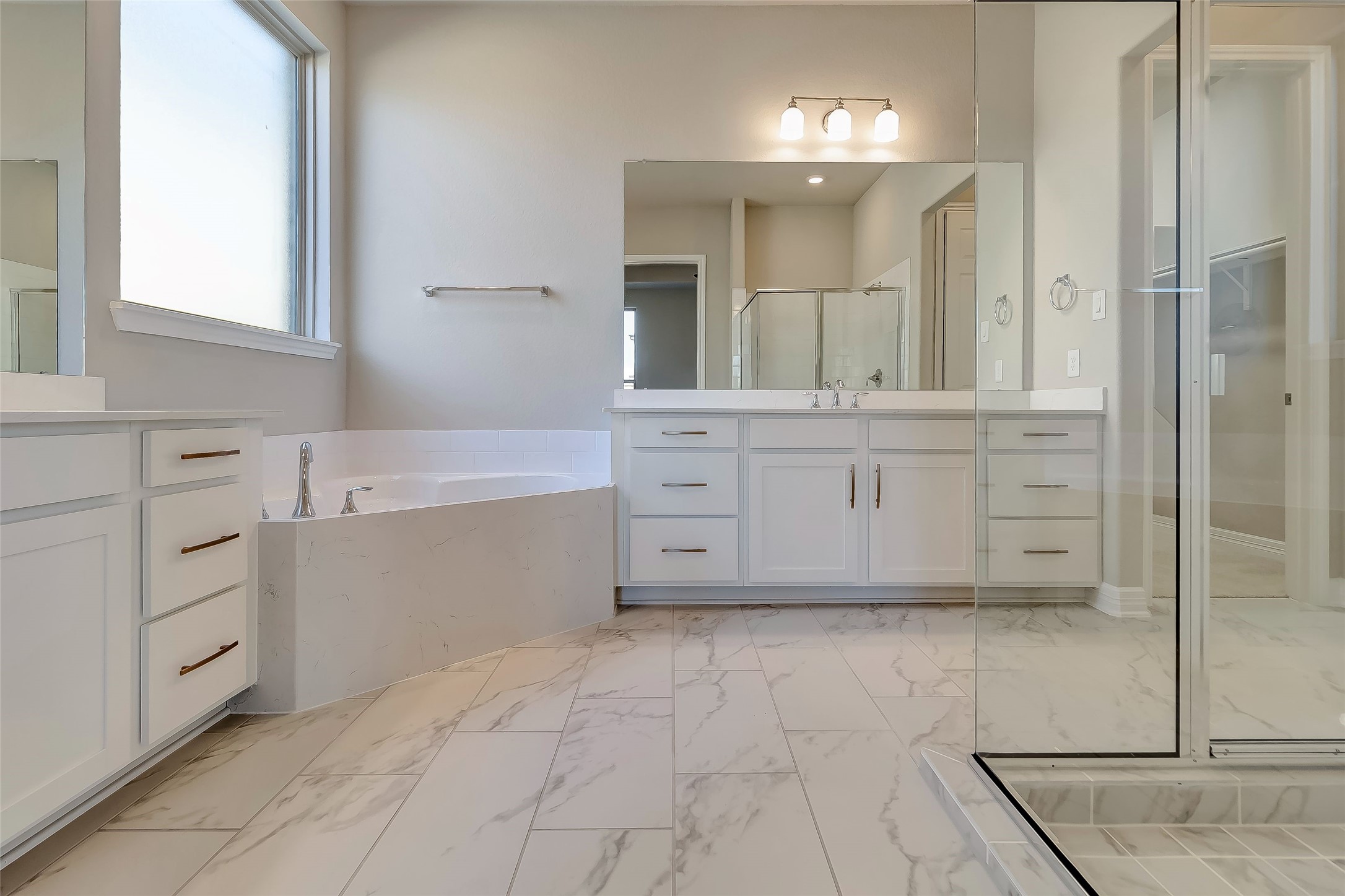 30827 Swift Hill Waller, TX 77484 - Photo 7 of 19 a spacious bathroom with a mirror sink and cabinets