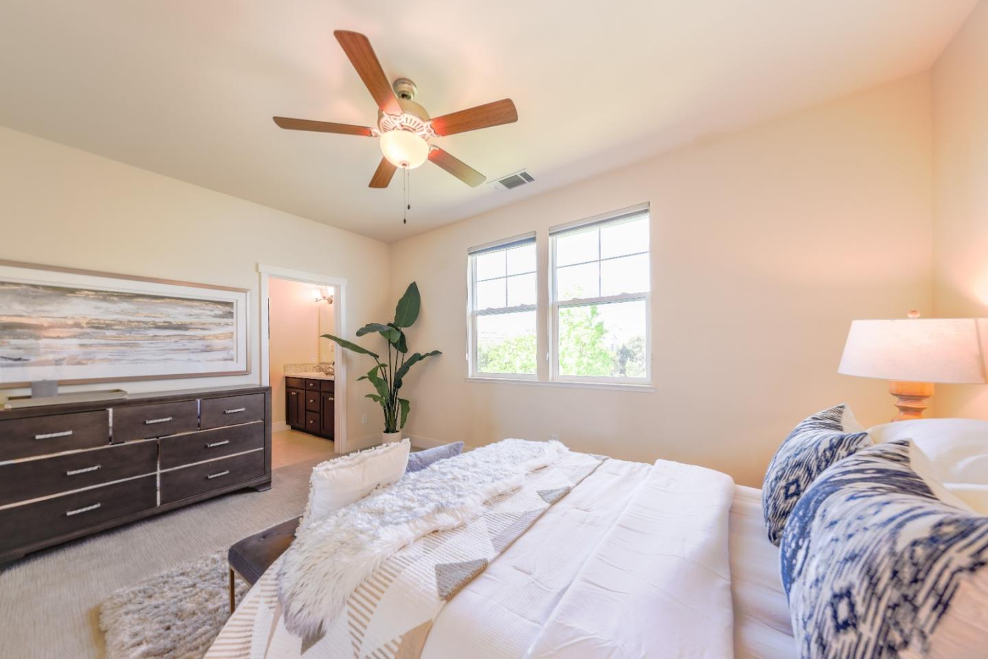 1095 Interlaken Terrace Sunnyvale, CA 94089 - Photo 11 of 25 a bedroom with a bed and a chandelier