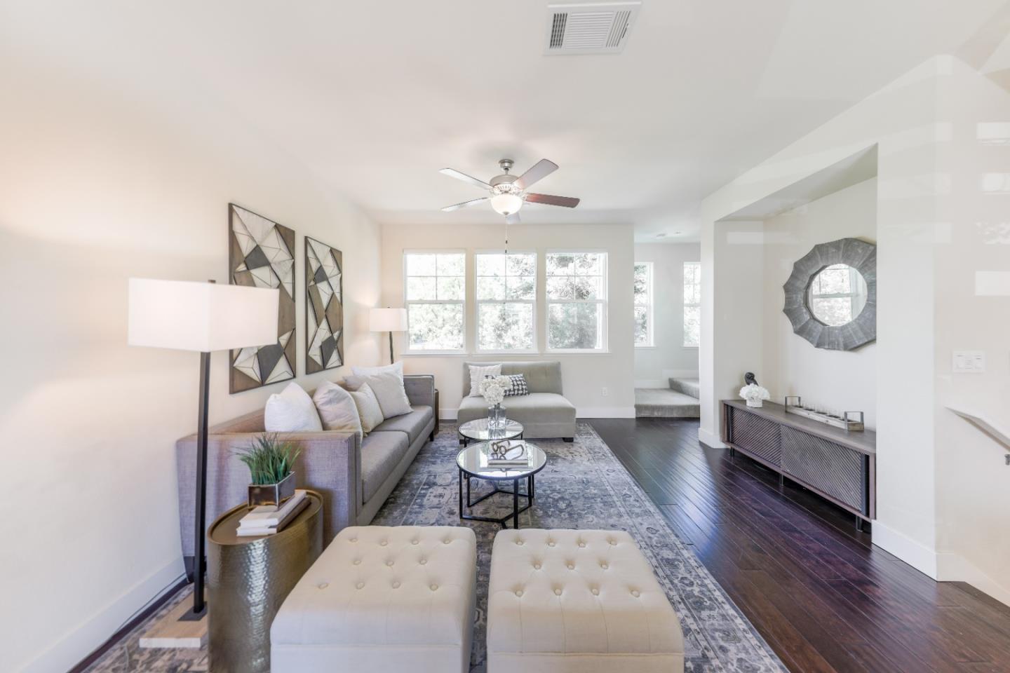 1095 Interlaken Terrace Sunnyvale, CA 94089 - Photo 2 of 25 a living room with furniture a window and a chandelier
