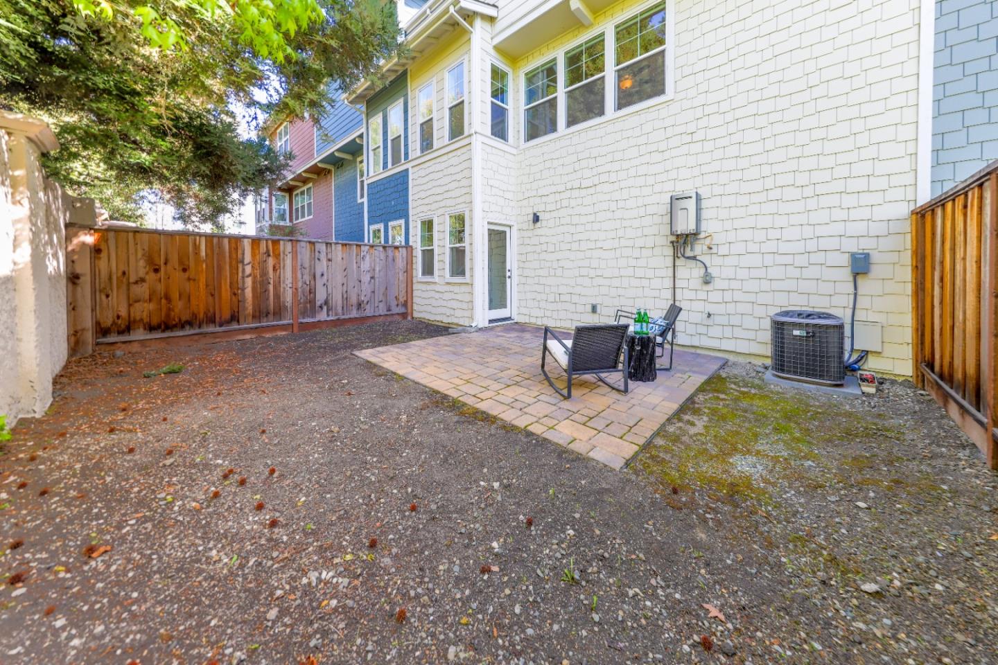 1095 Interlaken Terrace Sunnyvale, CA 94089 - Photo 22 of 25 a view of backyard of house and wooden fence