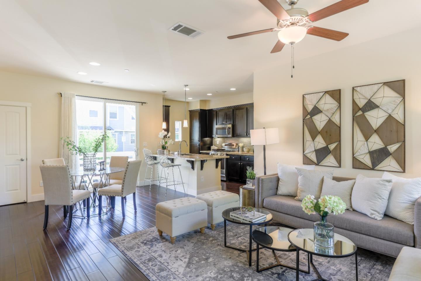 1095 Interlaken Terrace Sunnyvale, CA 94089 - Photo 4 of 25 a living room with furniture kitchen view and a wooden floor