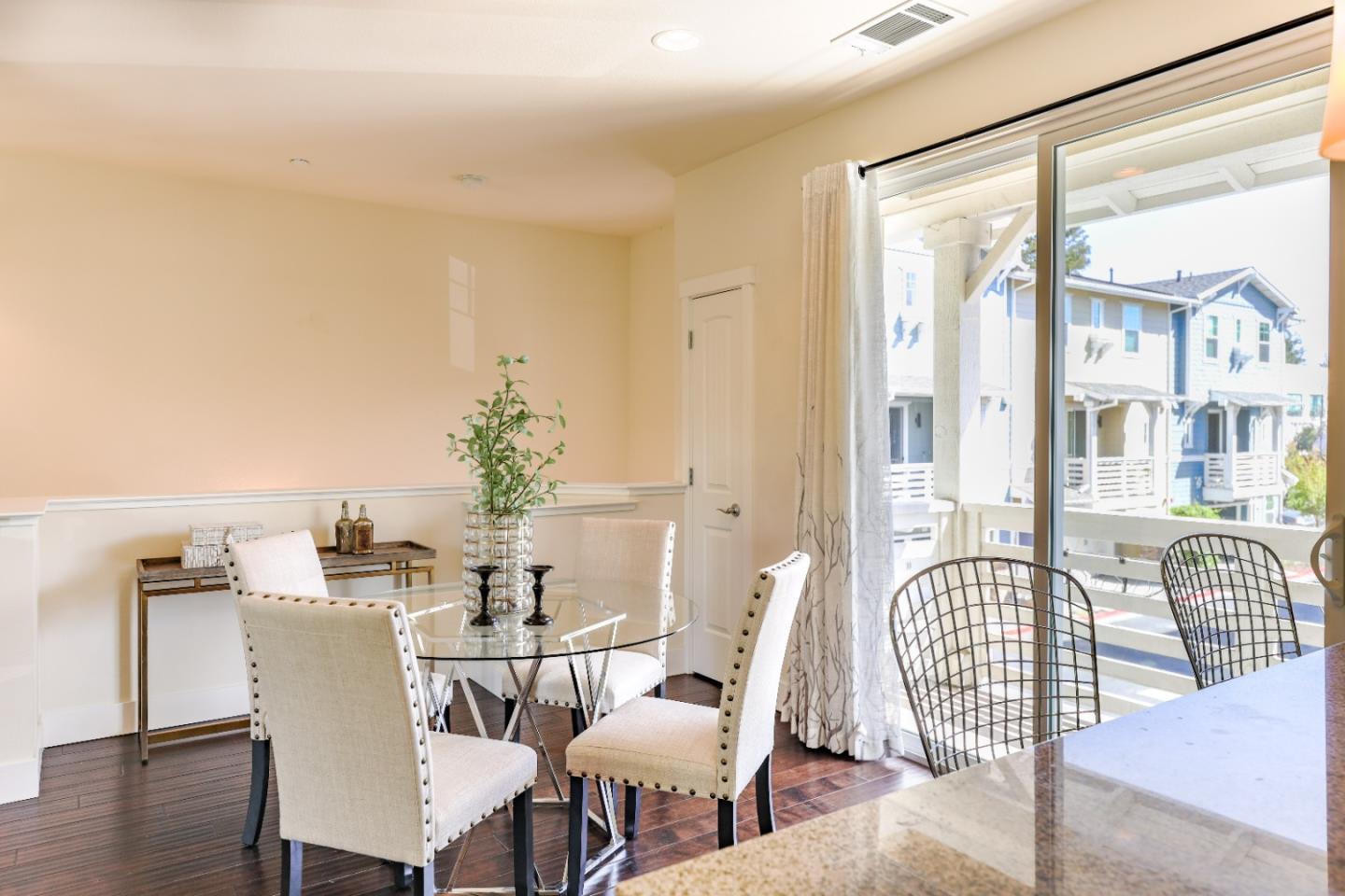 1095 Interlaken Terrace Sunnyvale, CA 94089 - Photo 6 of 25 a view of a dining room with furniture and wooden floor