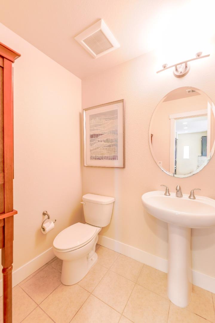 1095 Interlaken Terrace Sunnyvale, CA 94089 - Photo 10 of 25 a bathroom with a toilet sink and mirror