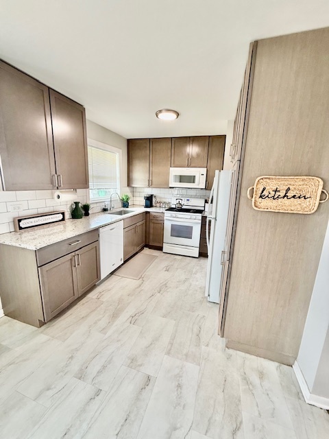 9128 Pembroke Lane Bridgeview, IL 60455 - Photo 5 of 14 a kitchen with stainless steel appliances a sink a stove a refrigerator and cabinets