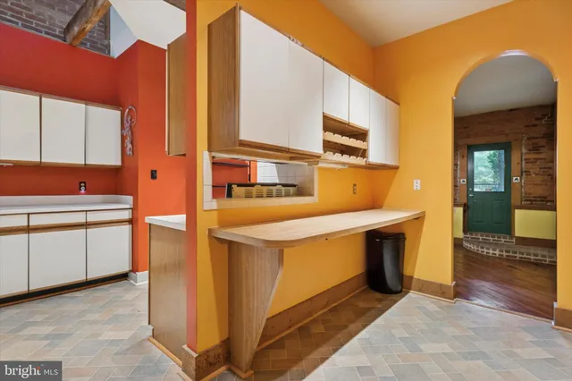 a kitchen view with stainless steel appliances granite countertop a stove and a sink