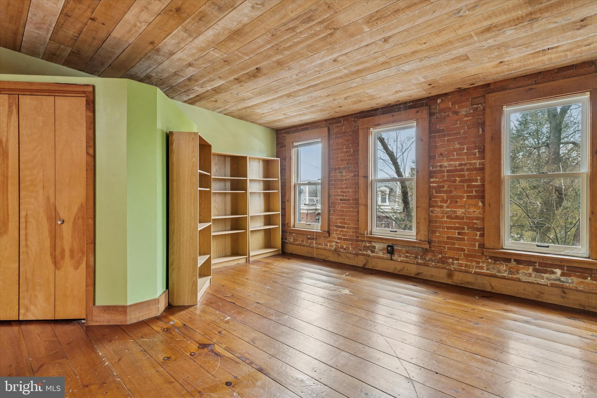 409 Lancaster Avenue Lancaster, PA 17603 - Photo 43 of 52 a view of an empty room with wooden floor and a window