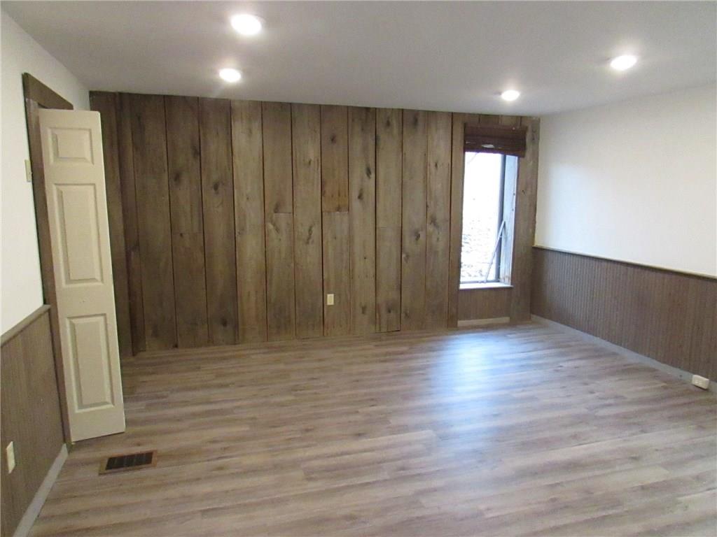368 Kate Houk Road Wampum, PA 16157 - Photo 3 of 22 Family room with new laminated floors.