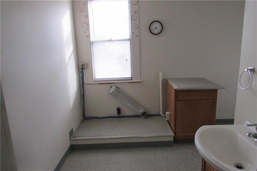 368 Kate Houk Road Wampum, PA 16157 - Photo 6 of 22 Main floor bathroom with area for washer and dryer.