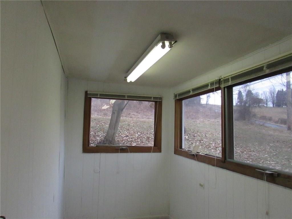 368 Kate Houk Road Wampum, PA 16157 - Photo 9 of 22 Back door entrance room can be used for a den.