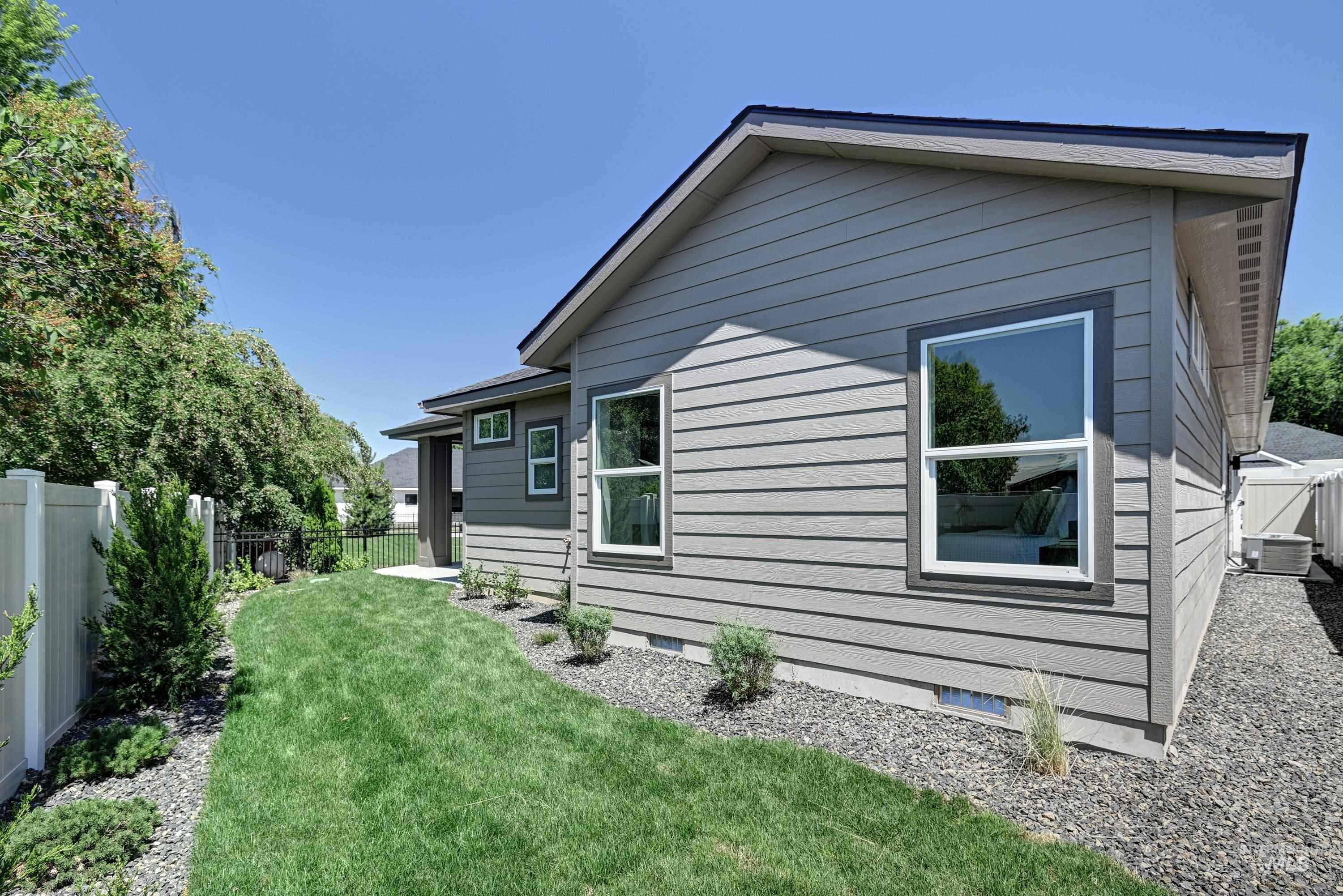 1469 North Parkshire Way Meridian, ID 83642 - Photo 33 of 43 View of home's exterior with a fenced backyard and crawl space
