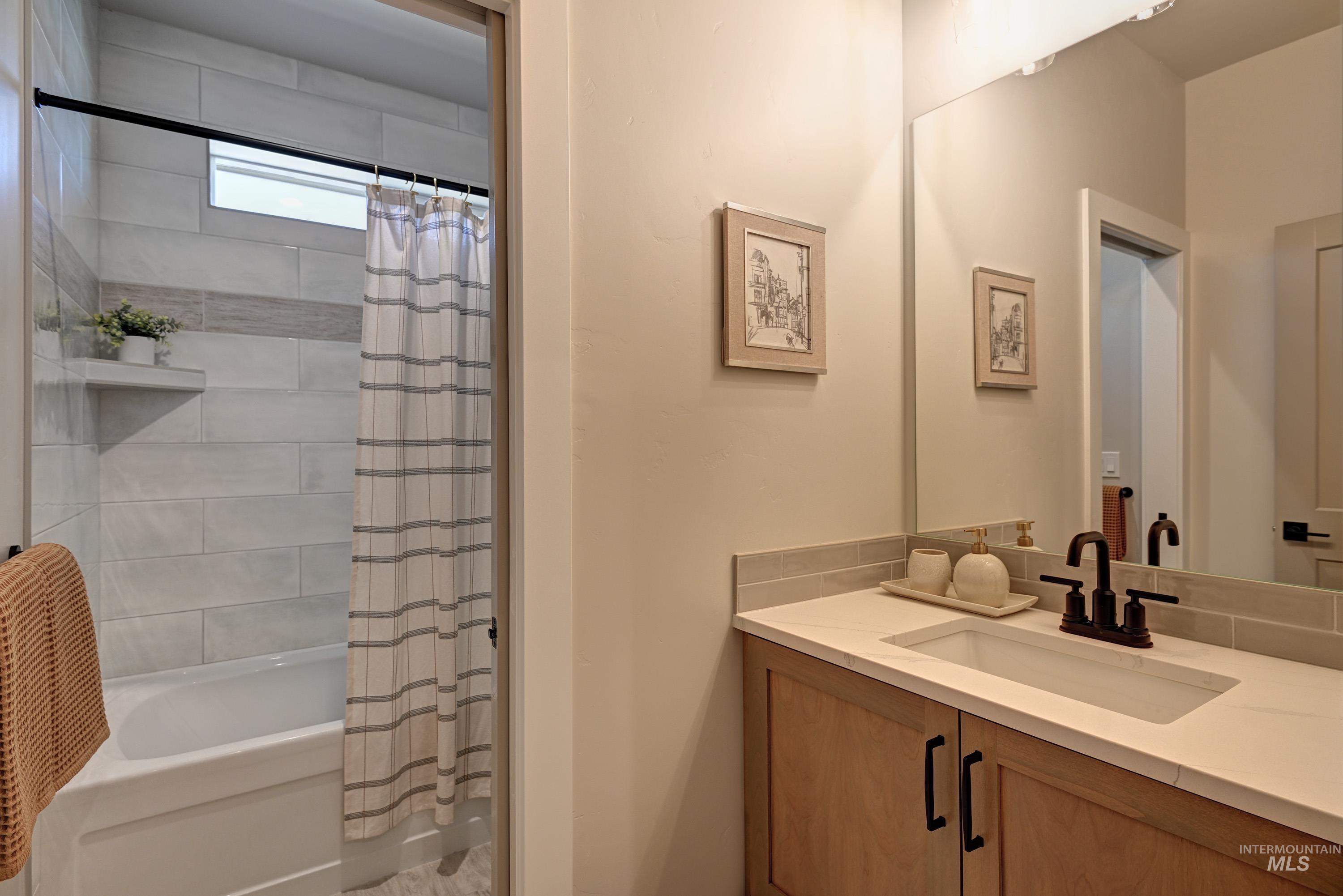 1469 North Parkshire Way Meridian, ID 83642 - Photo 9 of 43 Bathroom featuring vanity and shower / tub combo with curtain