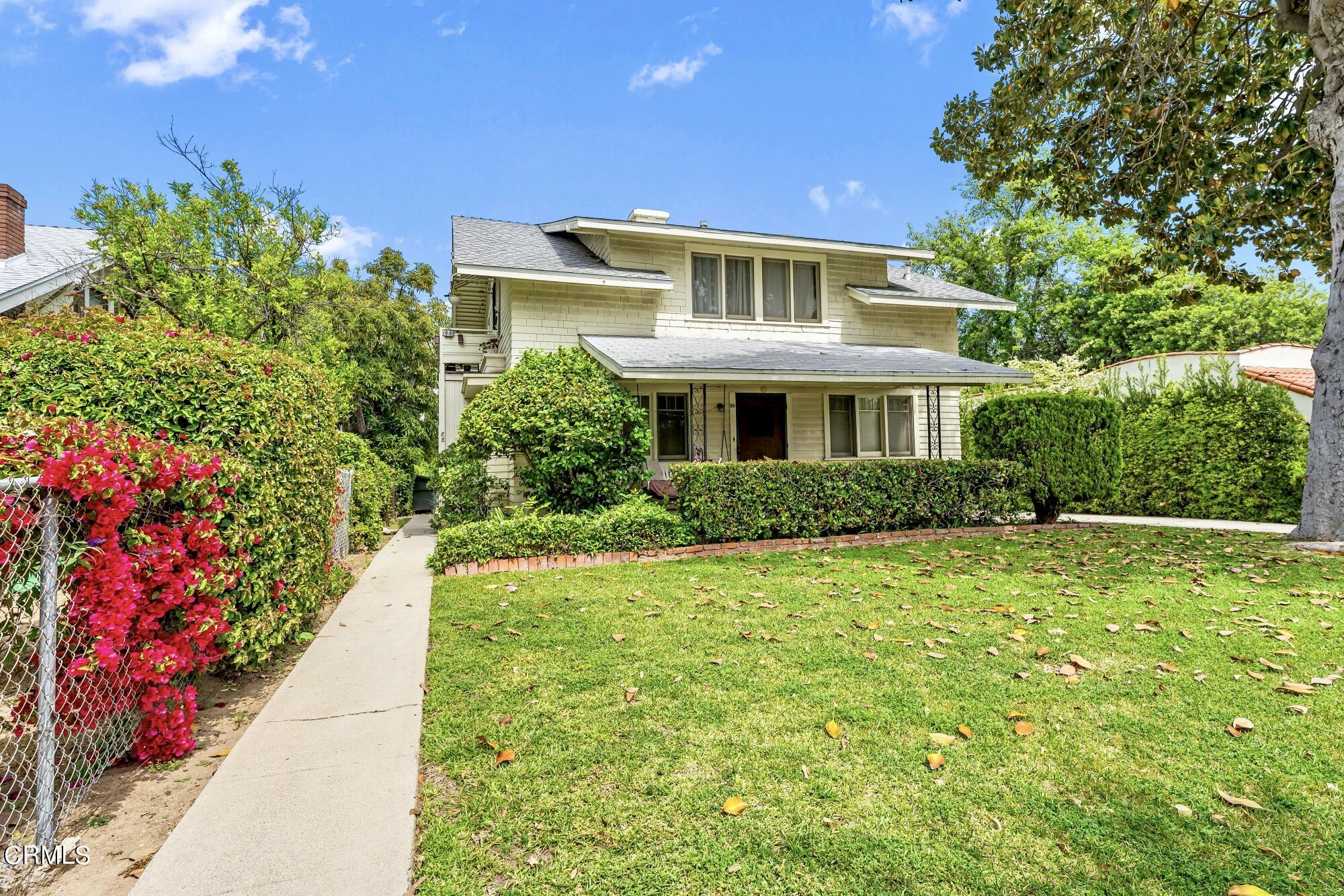 88 South Berkeley Avenue Pasadena, CA 91107 - Photo 3 of 23 a front view of a house with a yard