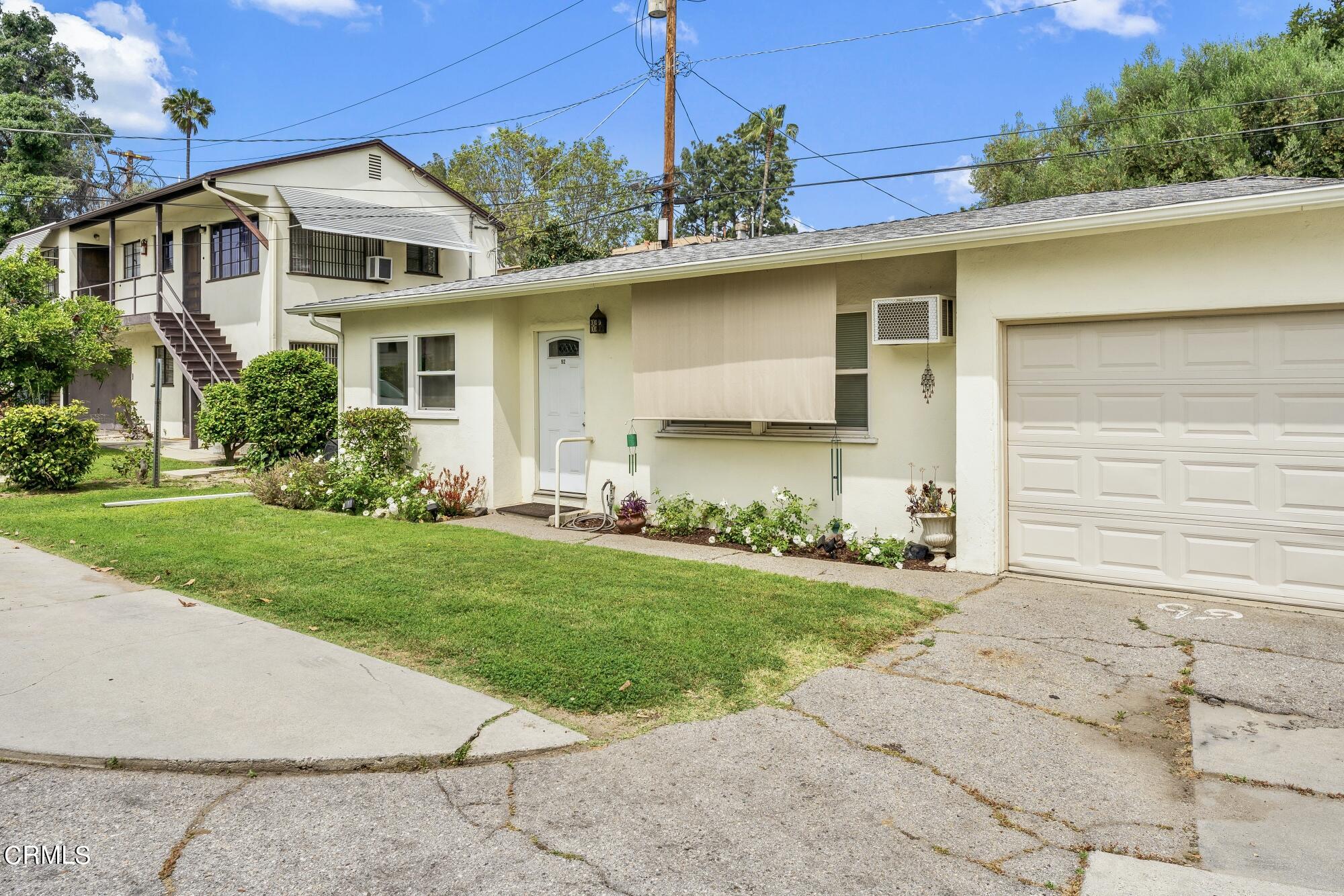 88 South Berkeley Avenue Pasadena, CA 91107 - Photo 7 of 23 a front view of a house with a yard