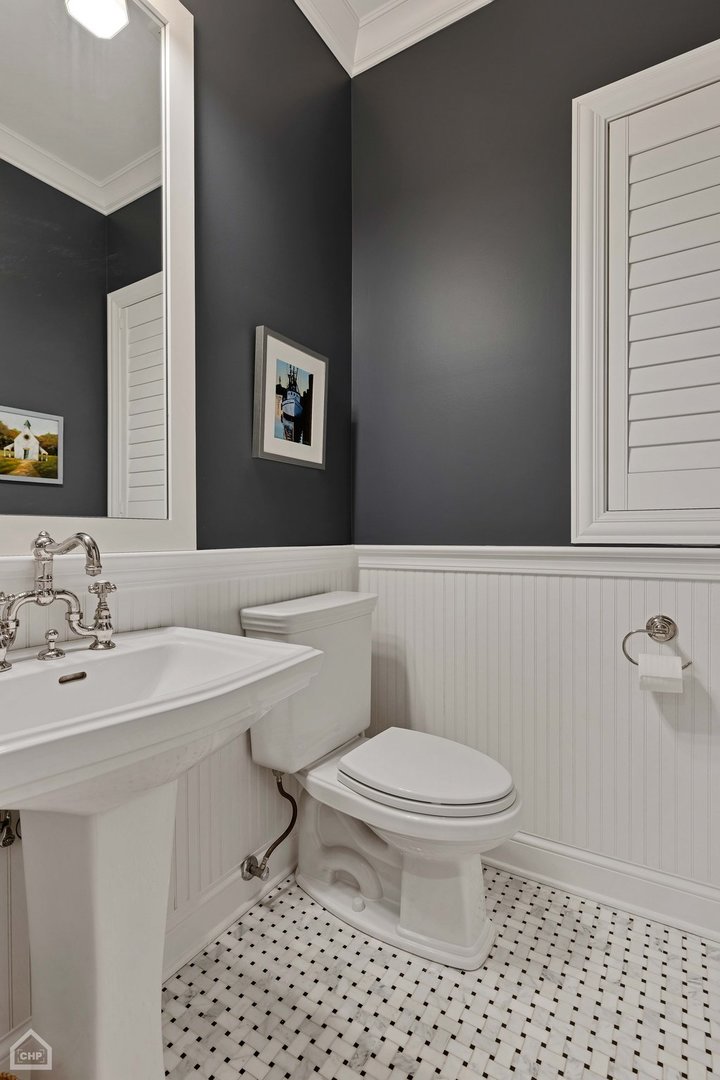 2242 North Seminary Avenue, Unit 1 Chicago, IL 60614 - Photo 14 of 37 a bathroom with a sink a toilet and a mirror