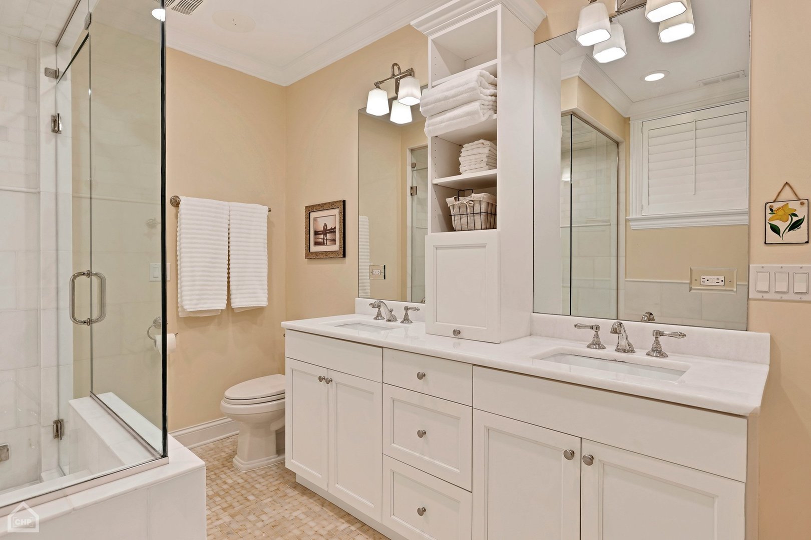 2242 North Seminary Avenue, Unit 1 Chicago, IL 60614 - Photo 16 of 37 a bathroom with a double vanity sink a toilet a mirror and shower