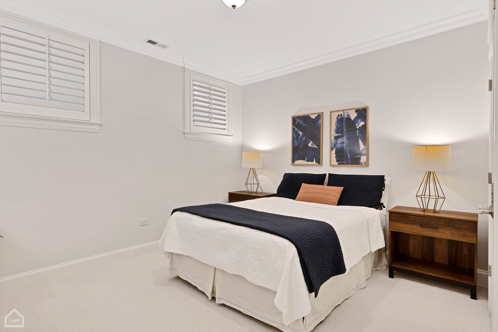 2242 North Seminary Avenue, Unit 1 Chicago, IL 60614 - Photo 19 of 37 a bedroom with a bed and a lamp