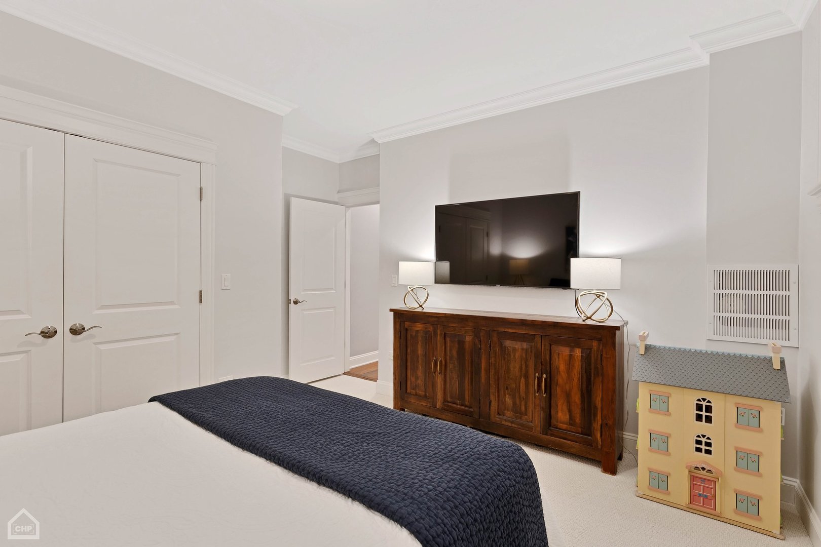 2242 North Seminary Avenue, Unit 1 Chicago, IL 60614 - Photo 20 of 37 a bedroom with a bed and a flat screen tv