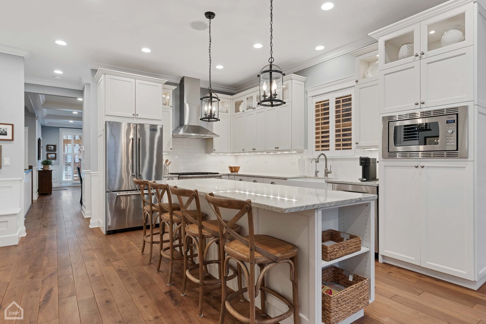2242 North Seminary Avenue, Unit 1 Chicago, IL 60614 - Photo 8 of 37 a kitchen with stainless steel appliances granite countertop a stove a refrigerator a oven a sink a dining table and chairs with wooden floor