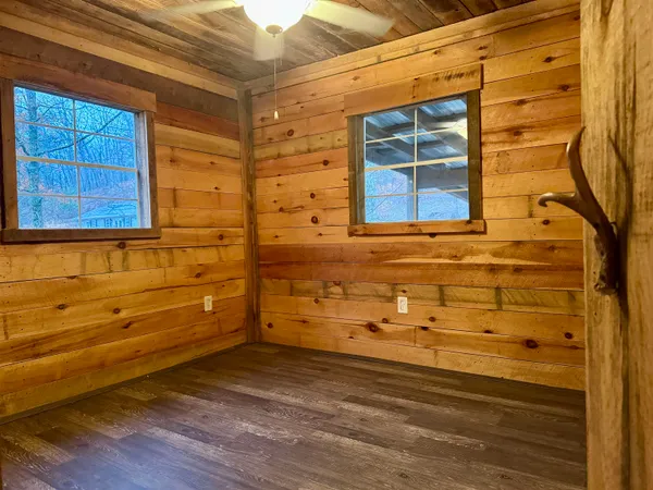 a view of a room with furniture and window