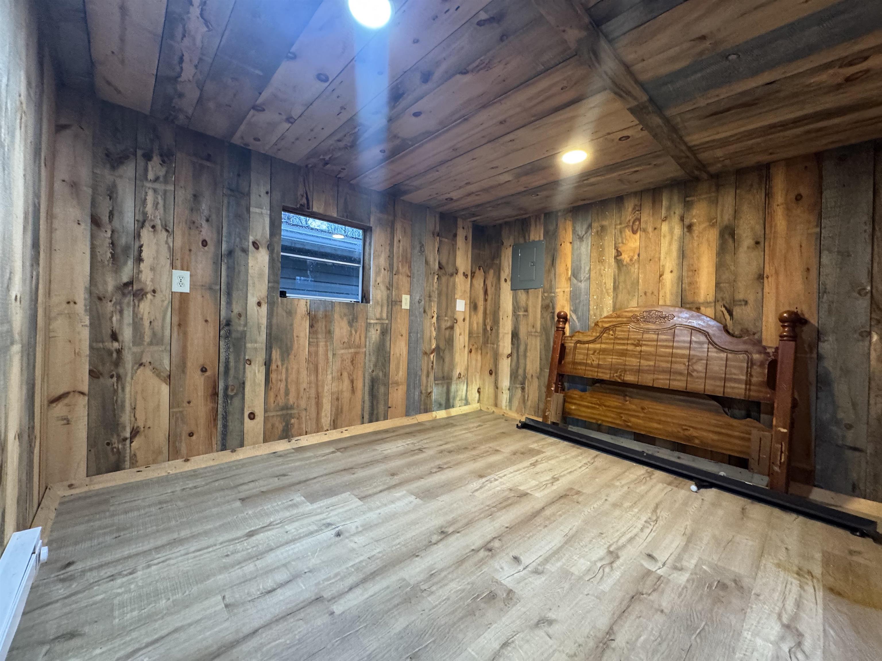 341 Buttercup Drive Mathias, WV 26812 - Photo 15 of 16 a view of an empty room with wooden floor
