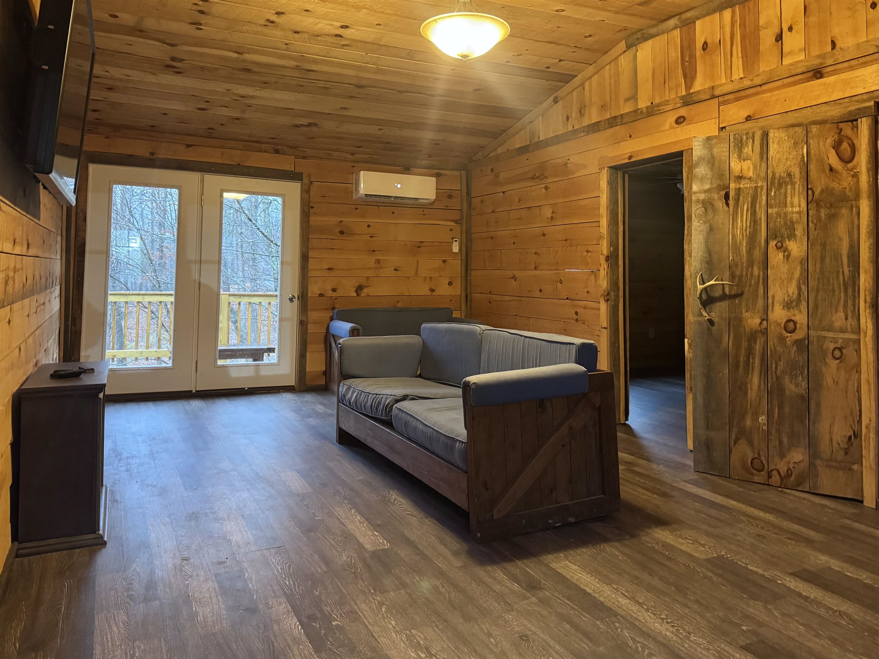 341 Buttercup Drive Mathias, WV 26812 - Photo 7 of 16 a living room with furniture and wooden floor