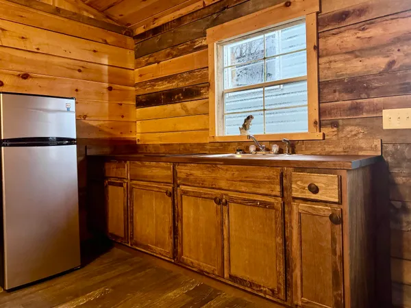 a bathroom with a sink mirror toilet and shower