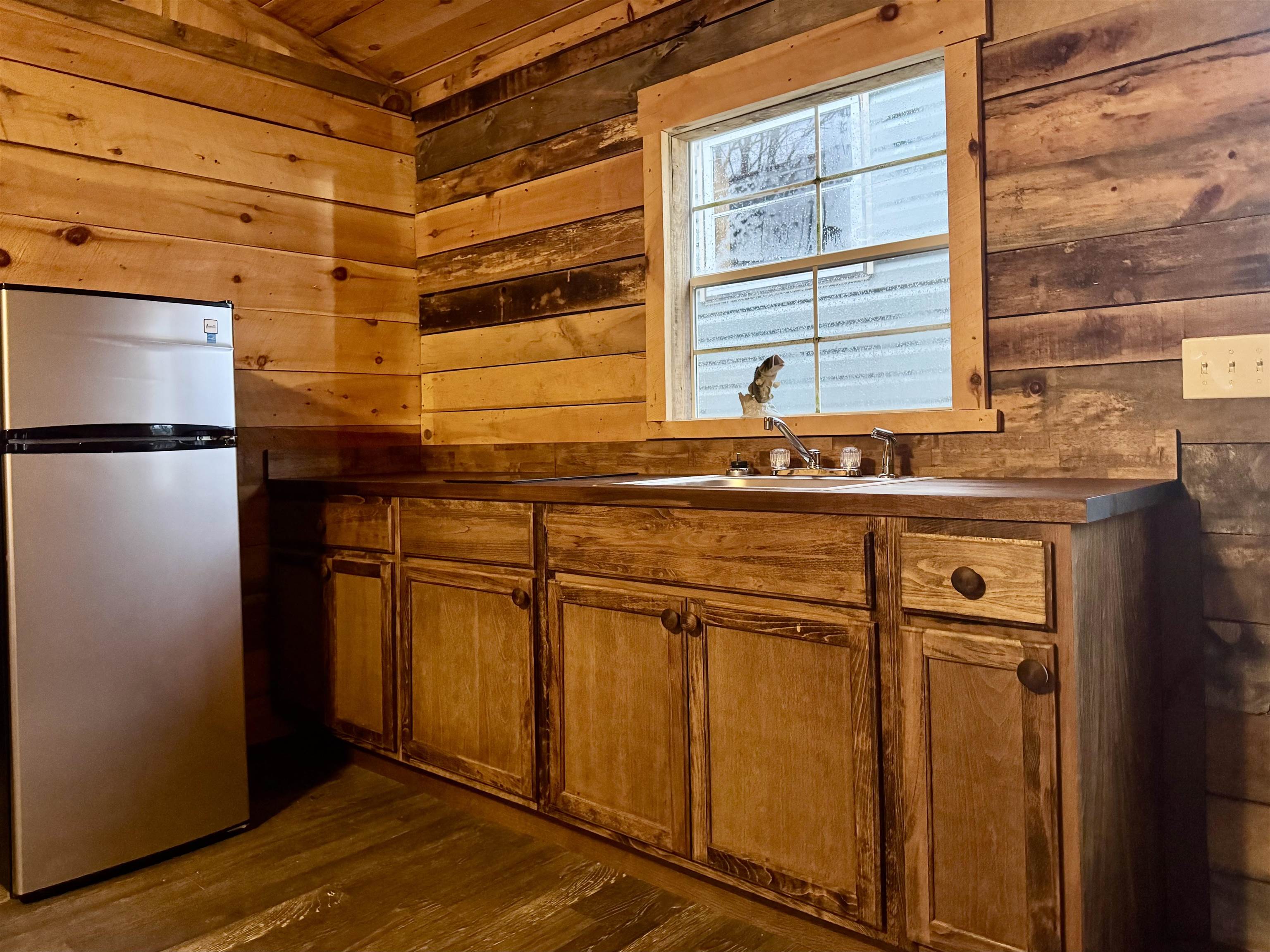 341 Buttercup Drive Mathias, WV 26812 - Photo 10 of 16 a kitchen with stainless steel appliances granite countertop a refrigerator and a sink