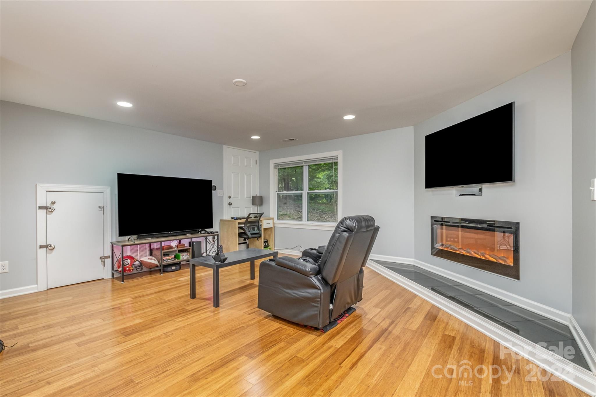 6200 Old Providence Road Charlotte, NC 28226 - Photo 16 of 24 a living room with furniture and a flat screen tv