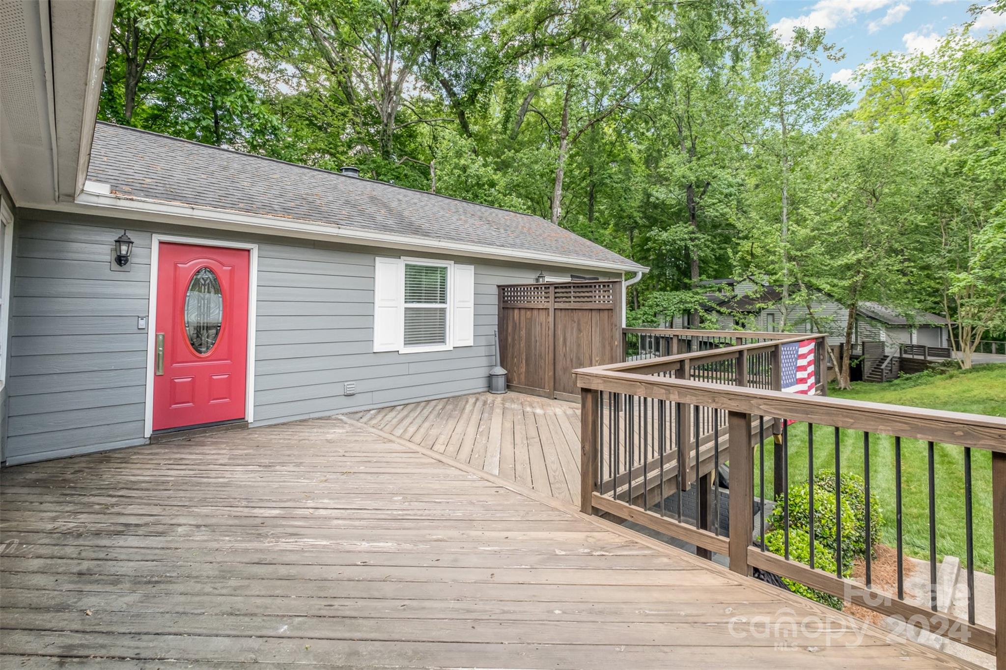 6200 Old Providence Road Charlotte, NC 28226 - Photo 23 of 24 a view of a wooden house and a yard with large trees