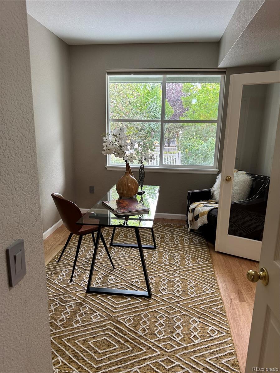 4501 Nelson Road, Unit 2104 Longmont, CO 80503 - Photo 13 of 29 a living room with furniture and a window