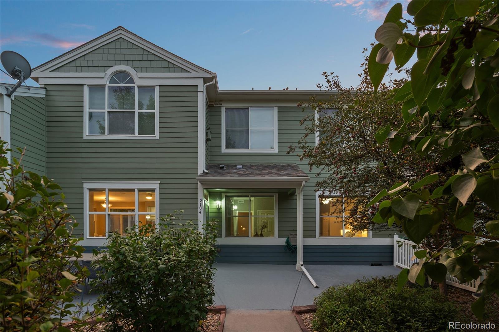 4501 Nelson Road, Unit 2104 Longmont, CO 80503 - Photo 17 of 29 a front view of a house with garden