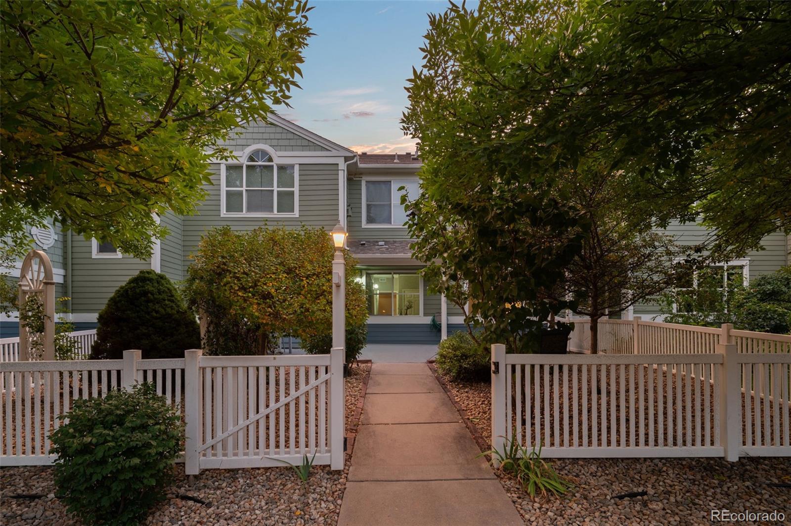 4501 Nelson Road, Unit 2104 Longmont, CO 80503 - Photo 18 of 29 a front view of house with deck and garden