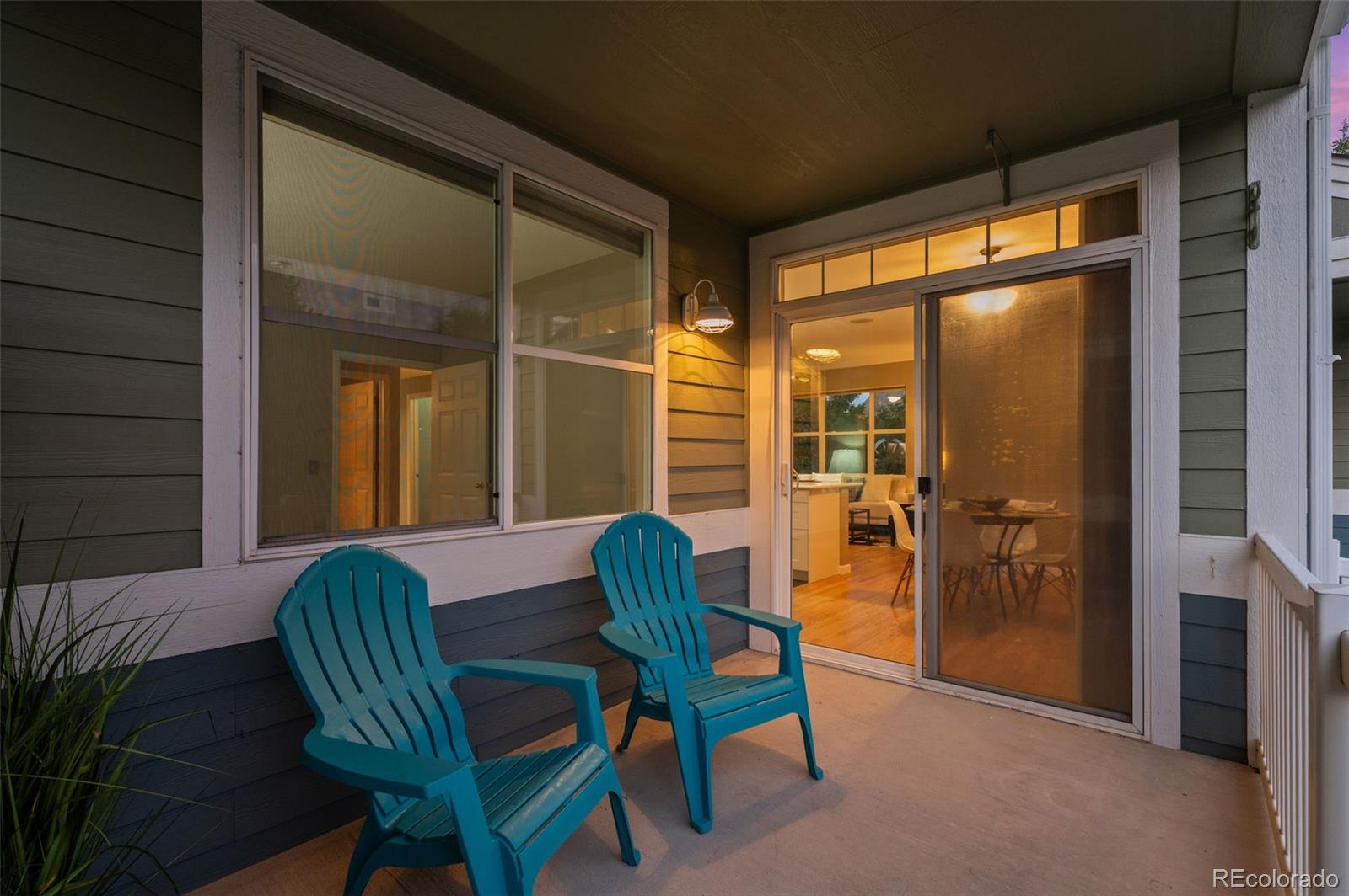 4501 Nelson Road, Unit 2104 Longmont, CO 80503 - Photo 20 of 29 a balcony with table and chairs