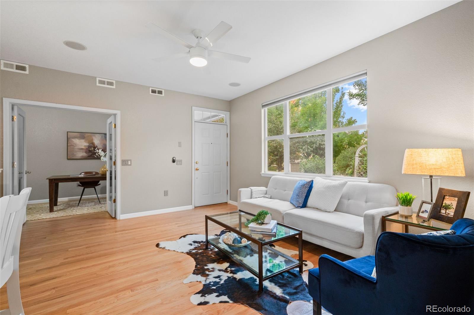 4501 Nelson Road, Unit 2104 Longmont, CO 80503 - Photo 3 of 29 a living room with furniture and a large window