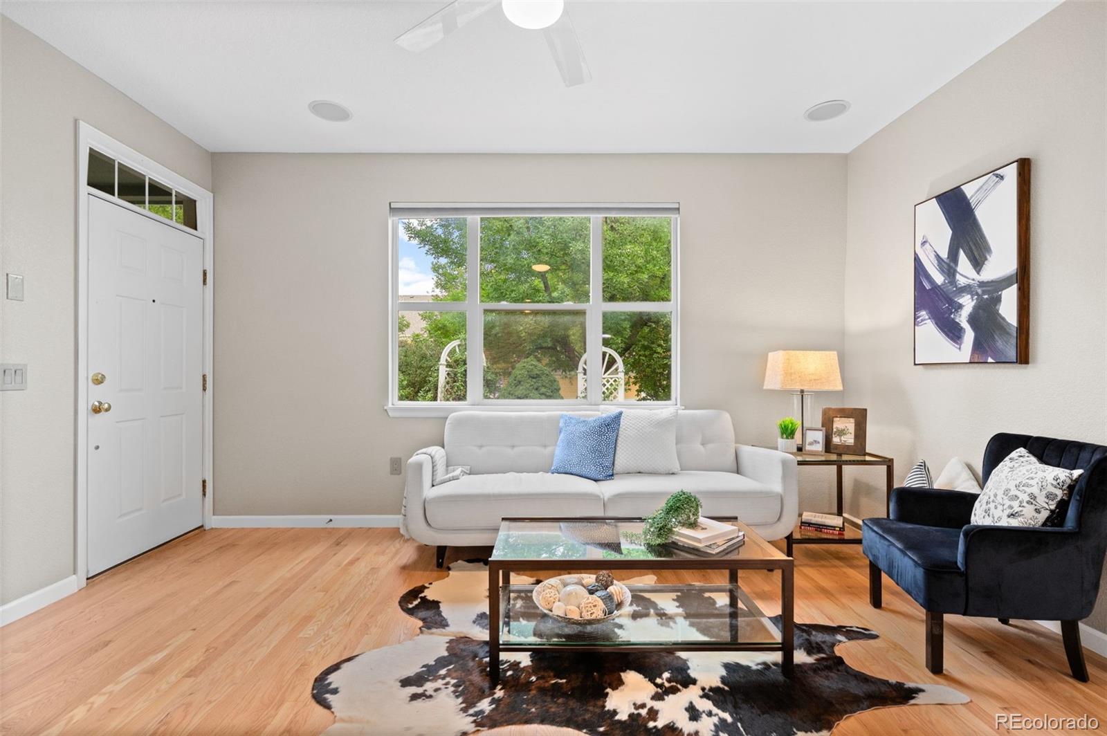 4501 Nelson Road, Unit 2104 Longmont, CO 80503 - Photo 4 of 29 a living room with furniture and a window