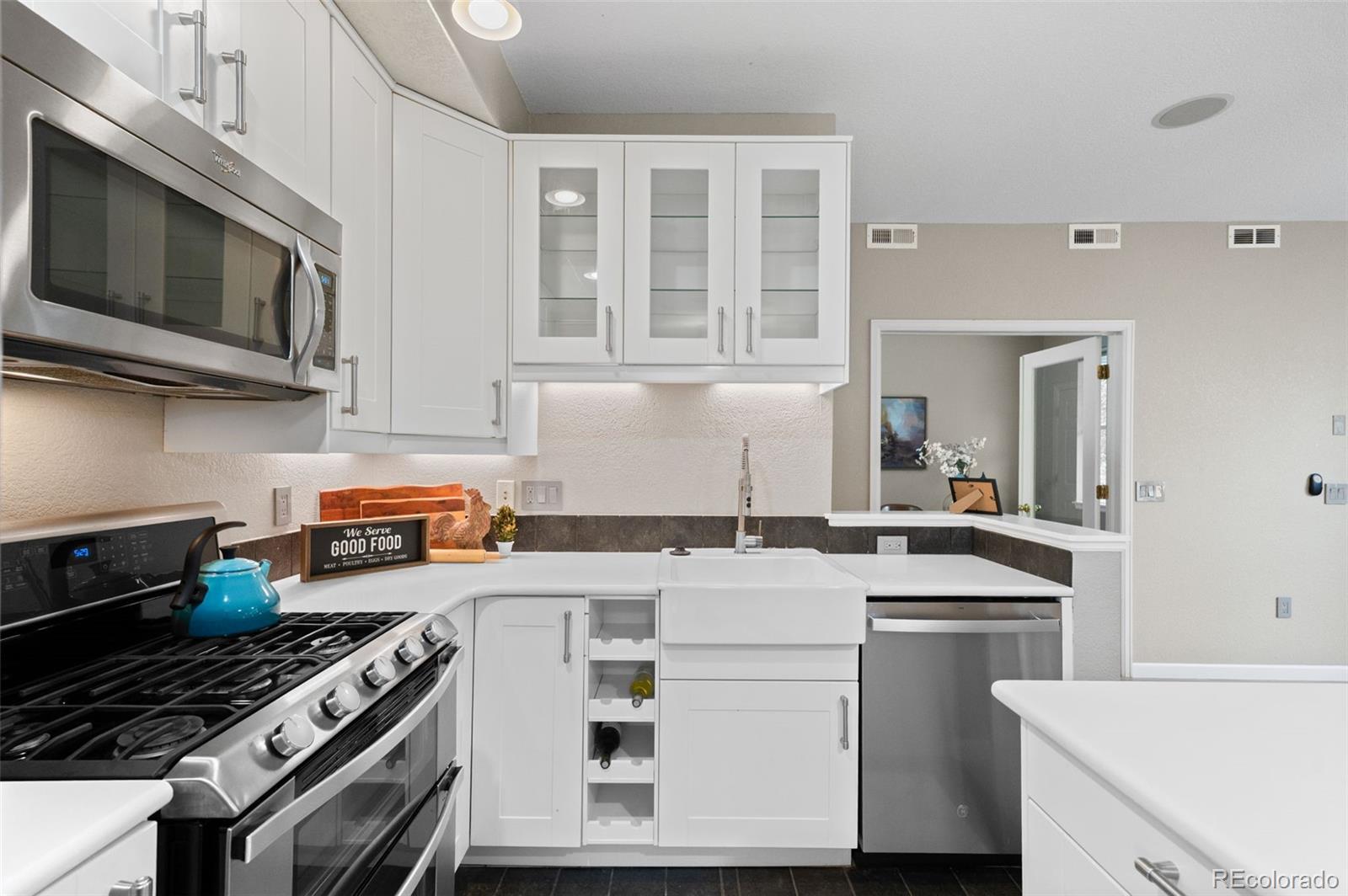 4501 Nelson Road, Unit 2104 Longmont, CO 80503 - Photo 5 of 29 a kitchen with a stove and a microwave