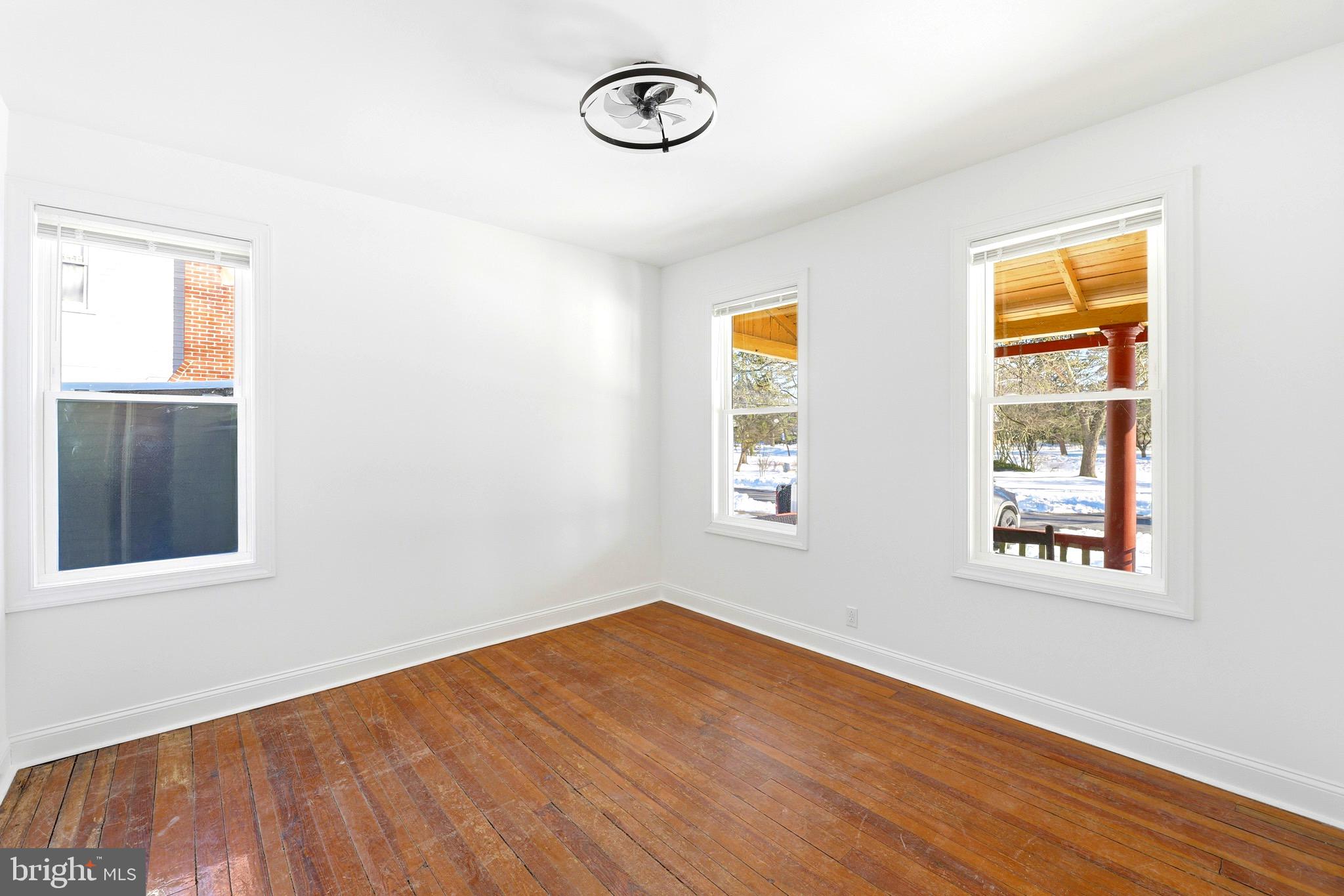 357 West 2nd Street Moorestown, NJ 08057 - Photo 14 of 23 an empty room with a window and wooden floor