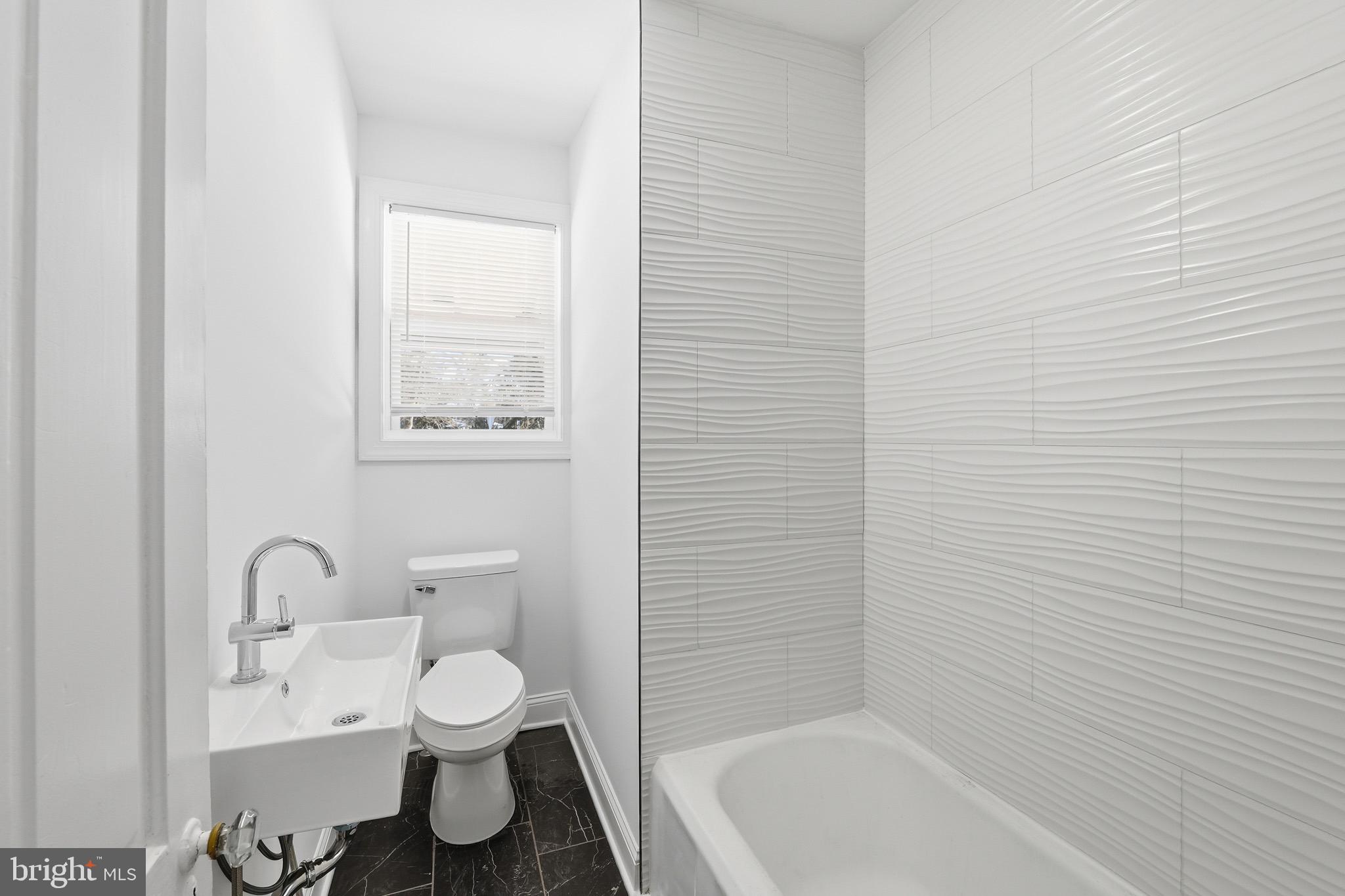 357 West 2nd Street Moorestown, NJ 08057 - Photo 17 of 23 a bathroom with a toilet a sink and bathtub